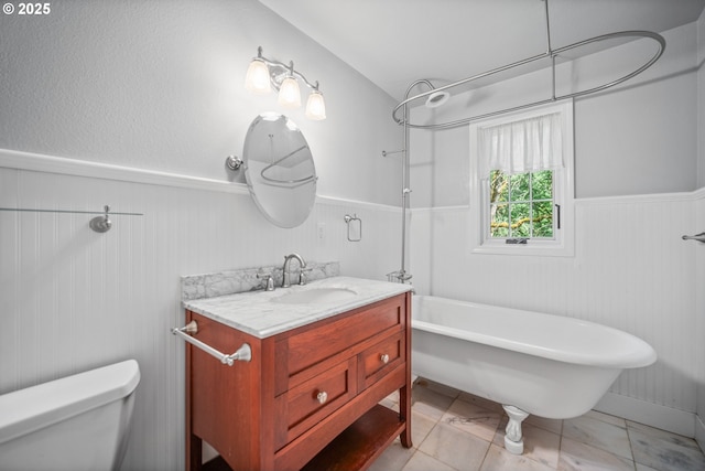 5807 NE 152nd Ave, Vancouver, WA 98682 - bathroom featuring wainscoting, vanity, and a combined bath / shower with freestanding tub