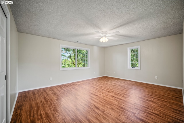 5807 NE 152nd Ave, Vancouver, WA 98682 - unfurnished room featuring plenty of natural light, ceiling fan, wood finished floors, and a textured ceiling