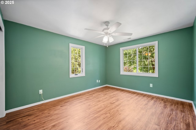 5807 NE 152nd Ave, Vancouver, WA 98682 - empty room featuring plenty of natural light, wood finished floors, and ceiling fan
