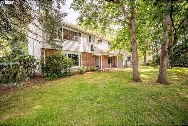 5807 NE 152nd Ave, Vancouver, WA 98682 - view of front facade featuring brick siding, a front lawn, and a chimney