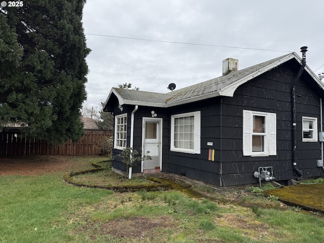 829 NE 107th Ave, Portland, OR 97220 - view of side of home featuring a chimney