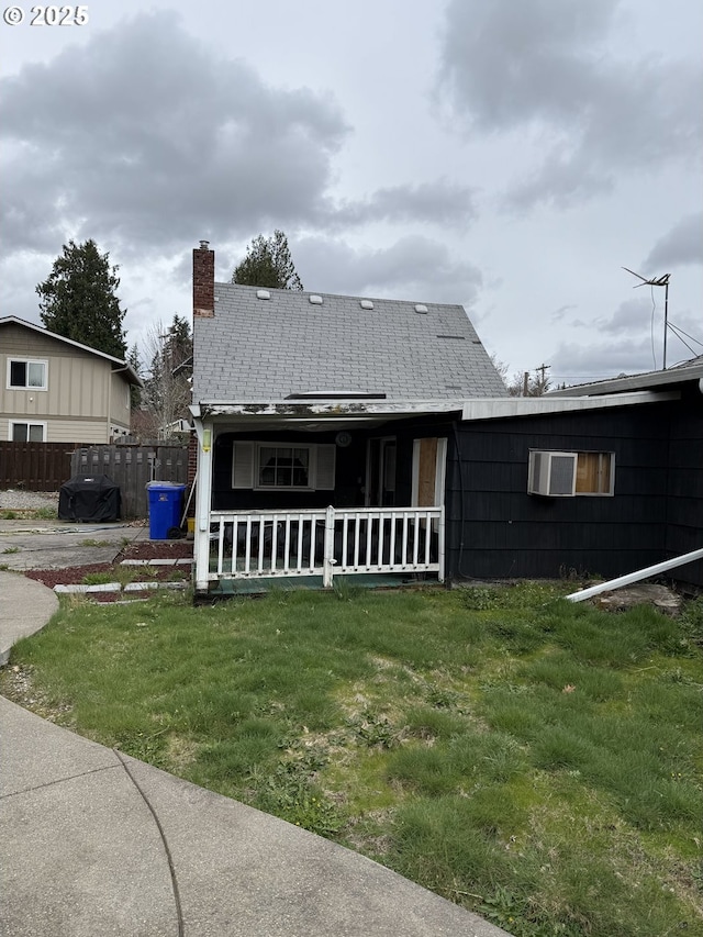 829 NE 107th Ave, Portland, OR 97220 - rear view of property with a chimney