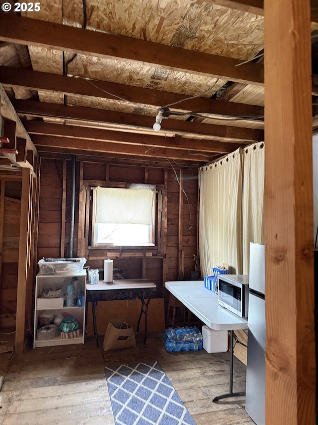 829 NE 107th Ave, Portland, OR 97220 - misc room with hardwood / wood-style flooring and wood walls