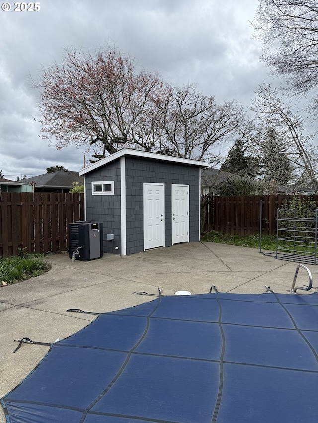 829 NE 107th Ave, Portland, OR 97220 - garage featuring a storage shed and central AC unit