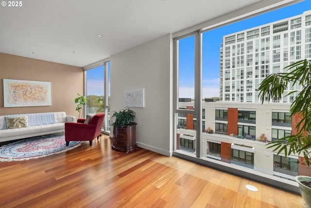 841 S Gaines St Unit 714, Portland, OR 97239 - sitting room featuring healthy amount of natural light, floor to ceiling windows, and wood finished floors