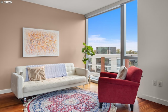 841 S Gaines St Unit 714, Portland, OR 97239 - living room featuring wood finished floors and a wall of windows