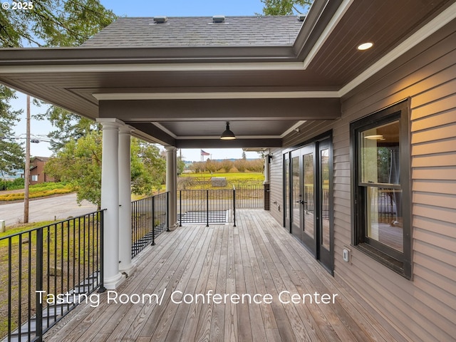 wooden terrace with french doors and covered porch