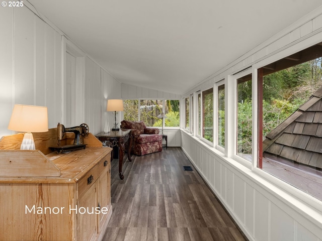 sunroom / solarium with visible vents and vaulted ceiling