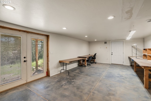 827 Tyler Creek Rd, Ashland, OR 97520 - miscellaneous room featuring concrete floors, recessed lighting, a workshop area, and french doors