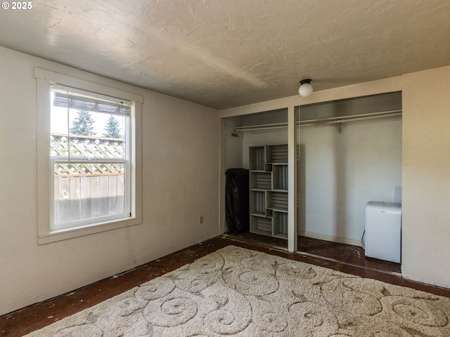 486 S Knott St, Canby, OR 97013 - unfurnished bedroom featuring two closets and a textured ceiling