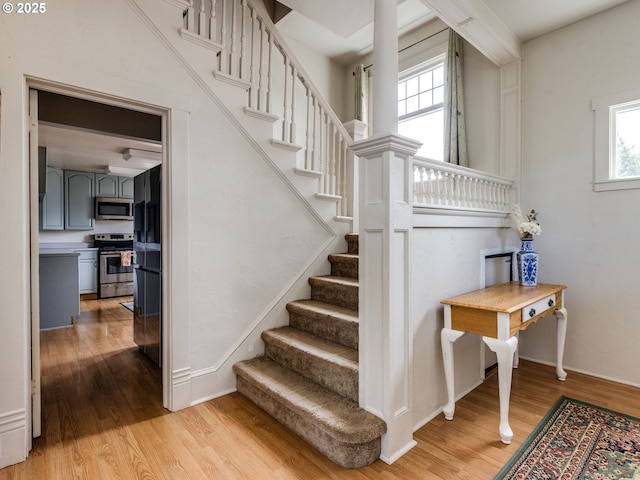 486 S Knott St, Canby, OR 97013 - stairway featuring wood finished floors and baseboards