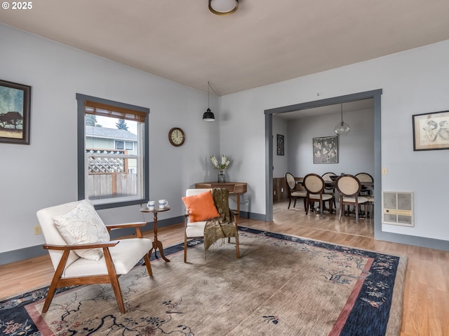 486 S Knott St, Canby, OR 97013 - sitting room featuring heating unit and wood finished floors