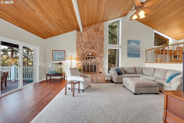 living room featuring high vaulted ceiling, a stone fireplace, wooden ceiling, and wood finished floors