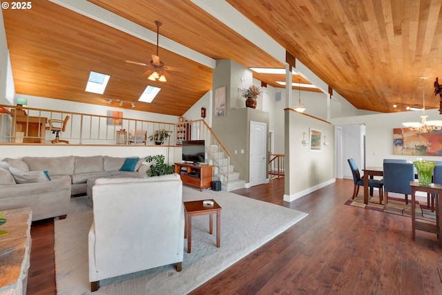 living area featuring a skylight, stairway, wood ceiling, wood finished floors, and high vaulted ceiling