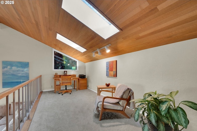 carpeted home office with wooden ceiling, baseboards, lofted ceiling with skylight, and rail lighting