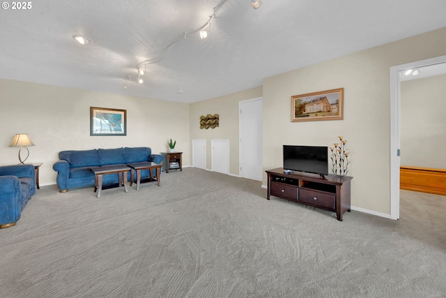 carpeted living area featuring baseboards