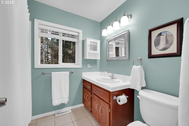 full bathroom featuring tile patterned flooring, toilet, visible vents, vanity, and baseboards