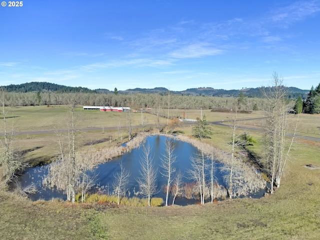 exterior space with a rural view and a water and mountain view