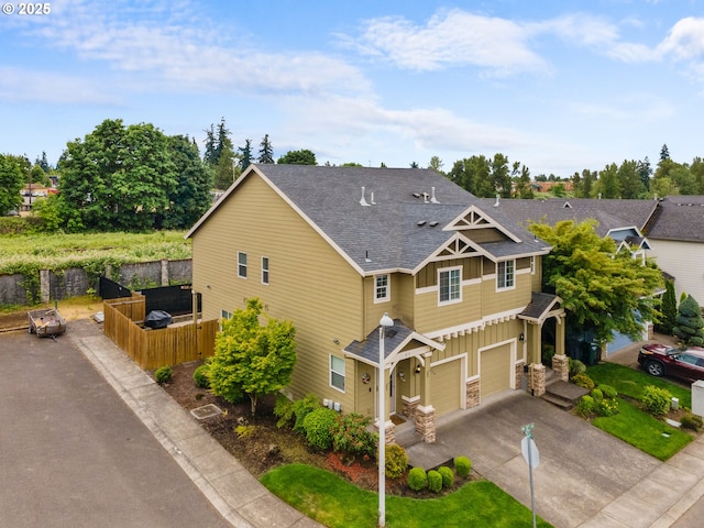 813 NW 1st Ave, Canby, OR 97013 - craftsman-style home featuring concrete driveway, board and batten siding, a shingled roof, an attached garage, and stone siding