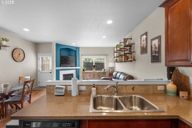 813 NW 1st Ave, Canby, OR 97013 - kitchen featuring a sink, dishwashing machine, open floor plan, recessed lighting, and wood finished floors