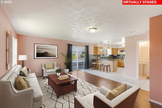 1825 Minnesota St, The Dalles, OR 97058 - living area with light wood finished floors and a textured ceiling
