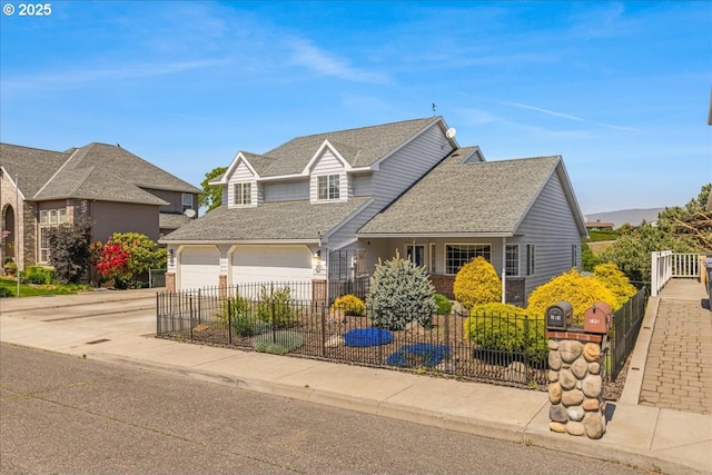 1825 Minnesota St, The Dalles, OR 97058 - view of front of home with an attached garage, driveway, a shingled roof, and fence private yard