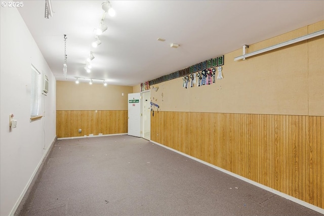 1825 Minnesota St, The Dalles, OR 97058 - basement with carpet floors, wood walls, track lighting, and a wainscoted wall
