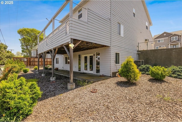 1825 Minnesota St, The Dalles, OR 97058 - back of property featuring fence, a patio, and french doors