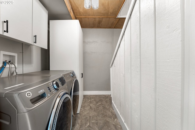 988 Savage Creek Rd, Grants Pass, OR 97527 - laundry room with cabinet space, washer and dryer, wood ceiling, and baseboards