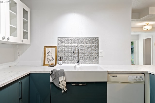 988 Savage Creek Rd, Grants Pass, OR 97527 - kitchen featuring dishwasher, glass insert cabinets, a sink, and light stone countertops