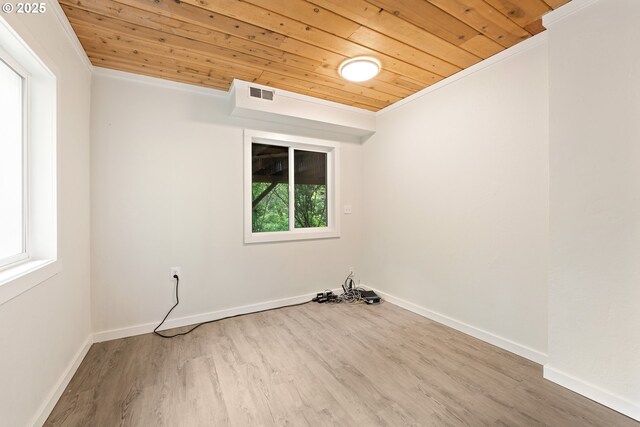 988 Savage Creek Rd, Grants Pass, OR 97527 - empty room featuring wooden ceiling, wood finished floors, baseboards, and ornamental molding