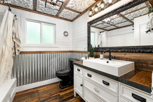 988 Savage Creek Rd, Grants Pass, OR 97527 - full bathroom featuring hardwood / wood-style floors, vanity, and toilet