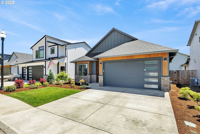 13009 NE 106th Cir, Vancouver, WA 98682 - contemporary house with board and batten siding, stone siding, roof with shingles, driveway, and cooling unit