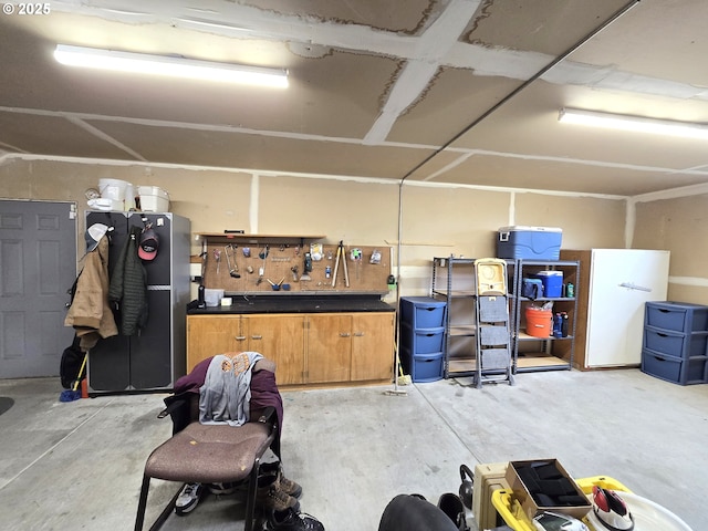 80393 Zimmer Ln, Hermiston, OR 97838 - garage with a workshop area and freestanding refrigerator