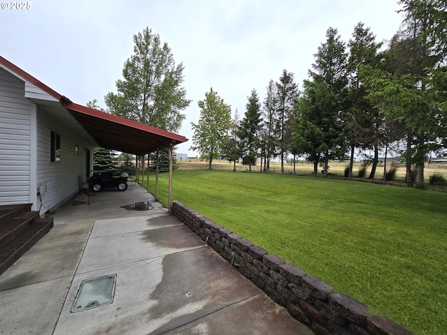 80393 Zimmer Ln, Hermiston, OR 97838 - view of grassy yard featuring concrete driveway and a carport