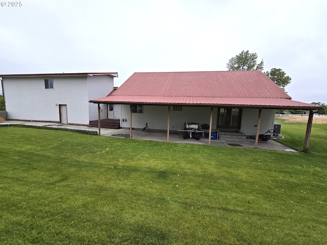 80393 Zimmer Ln, Hermiston, OR 97838 - back of house featuring entry steps, a yard, a patio area, and metal roof