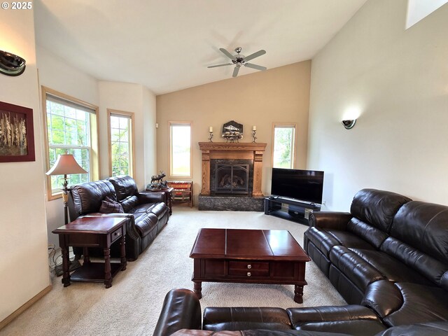 80393 Zimmer Ln, Hermiston, OR 97838 - carpeted living room featuring ceiling fan, vaulted ceiling, plenty of natural light, a premium fireplace, and baseboards