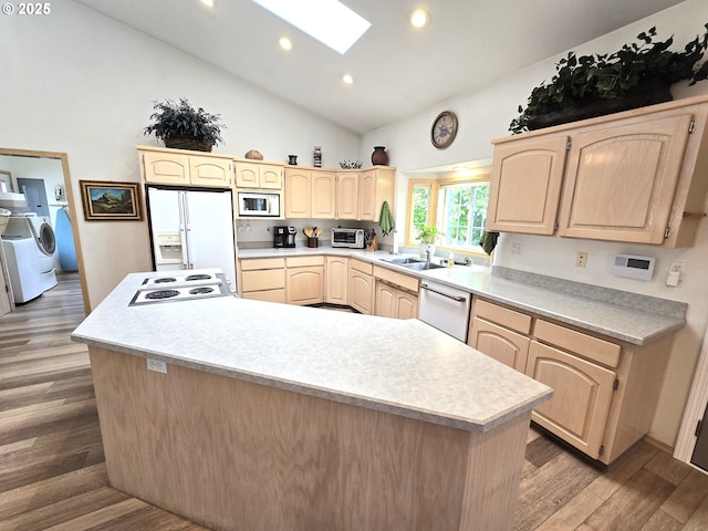80393 Zimmer Ln, Hermiston, OR 97838 - kitchen with light brown cabinets, white appliances, independent washer and dryer, a sink, and light countertops