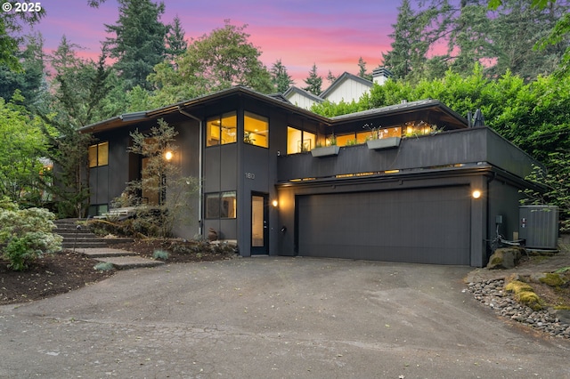 160 Iron Mountain Blvd, Lake Oswego, OR 97034 - contemporary house featuring an attached garage and asphalt driveway
