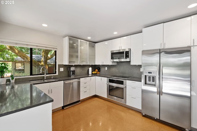 160 Iron Mountain Blvd, Lake Oswego, OR 97034 - kitchen featuring stainless steel appliances, dark countertops, tasteful backsplash, white cabinets, and recessed lighting