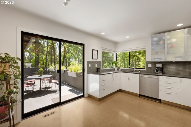 160 Iron Mountain Blvd, Lake Oswego, OR 97034 - kitchen featuring dishwasher, backsplash, dark countertops, white cabinetry, and glass insert cabinets
