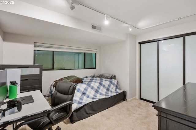 160 Iron Mountain Blvd, Lake Oswego, OR 97034 - bedroom featuring rail lighting, light colored carpet, a closet, and a desk