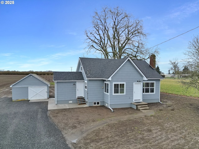 view of front of house featuring a storage shed