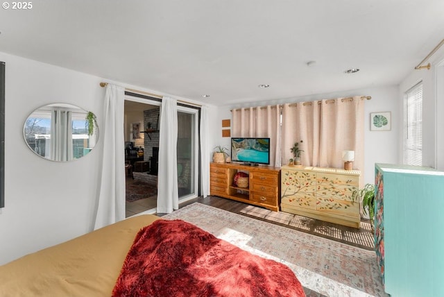 bedroom featuring a fireplace