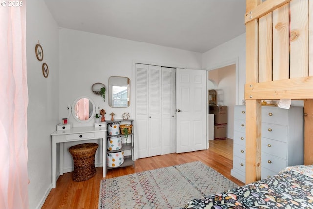 bedroom featuring light wood-style flooring and a closet