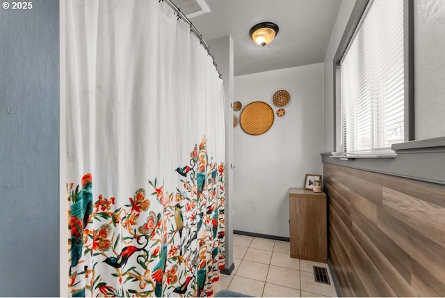 full bathroom with visible vents, curtained shower, and tile patterned flooring