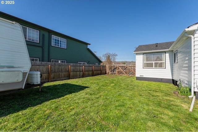 view of yard with a fenced backyard