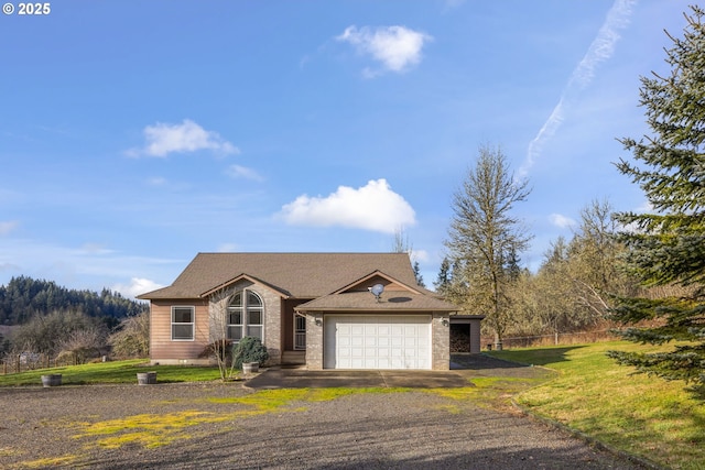 ranch-style house featuring a garage and a front yard