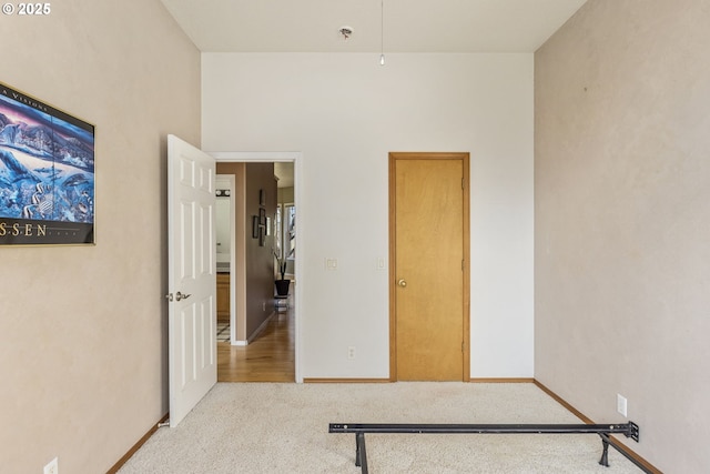 unfurnished bedroom featuring light colored carpet