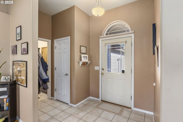 view of tiled foyer entrance